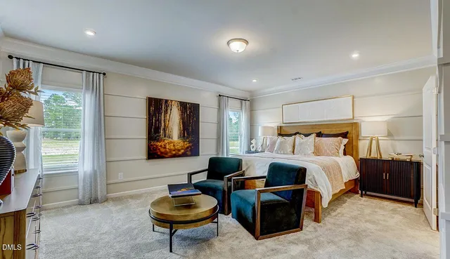 a bedroom with furniture and a window