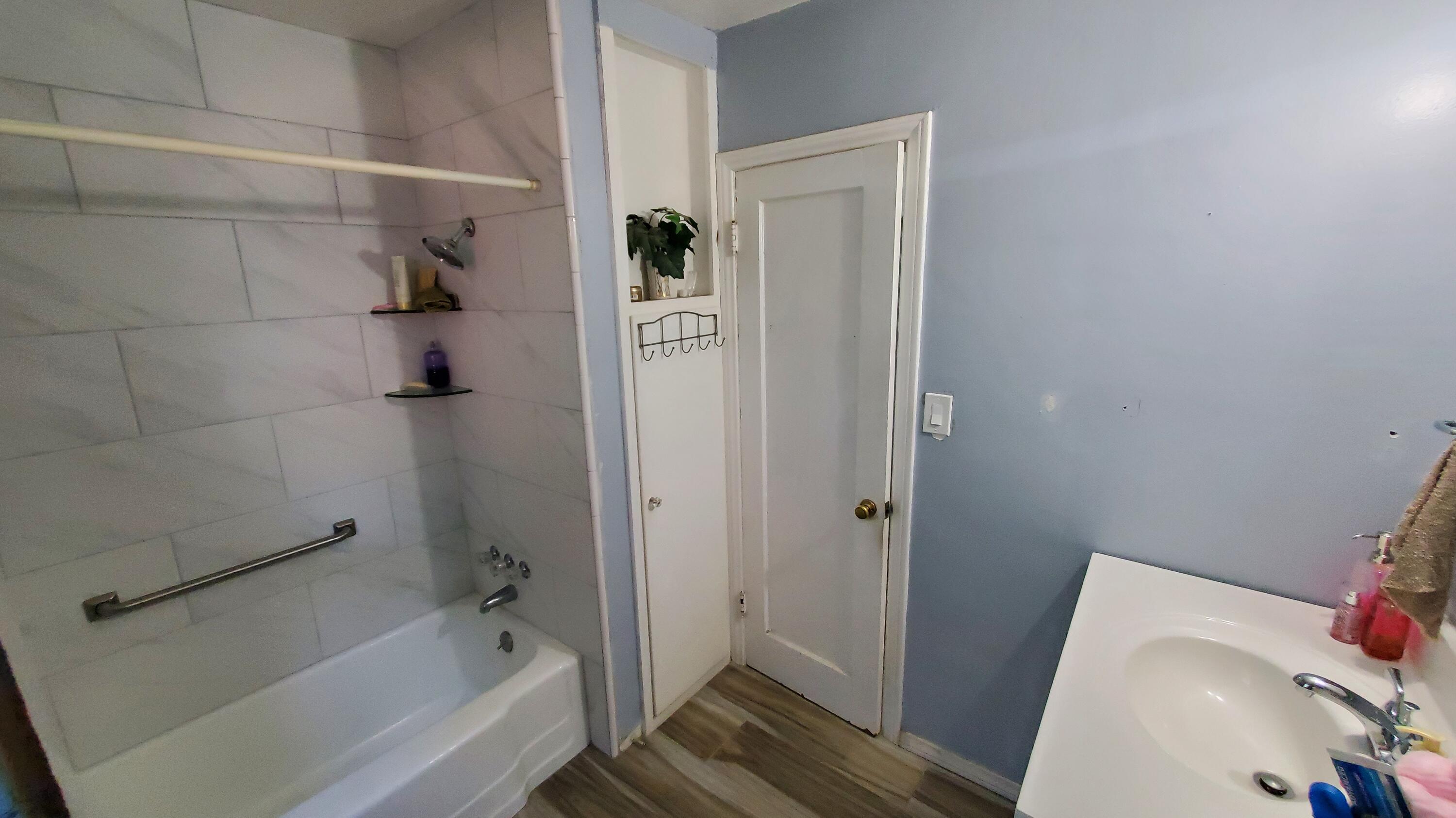 831 West George Street Banning, CA 92220 - Photo 16 of 39 a bathroom with a tub and shower