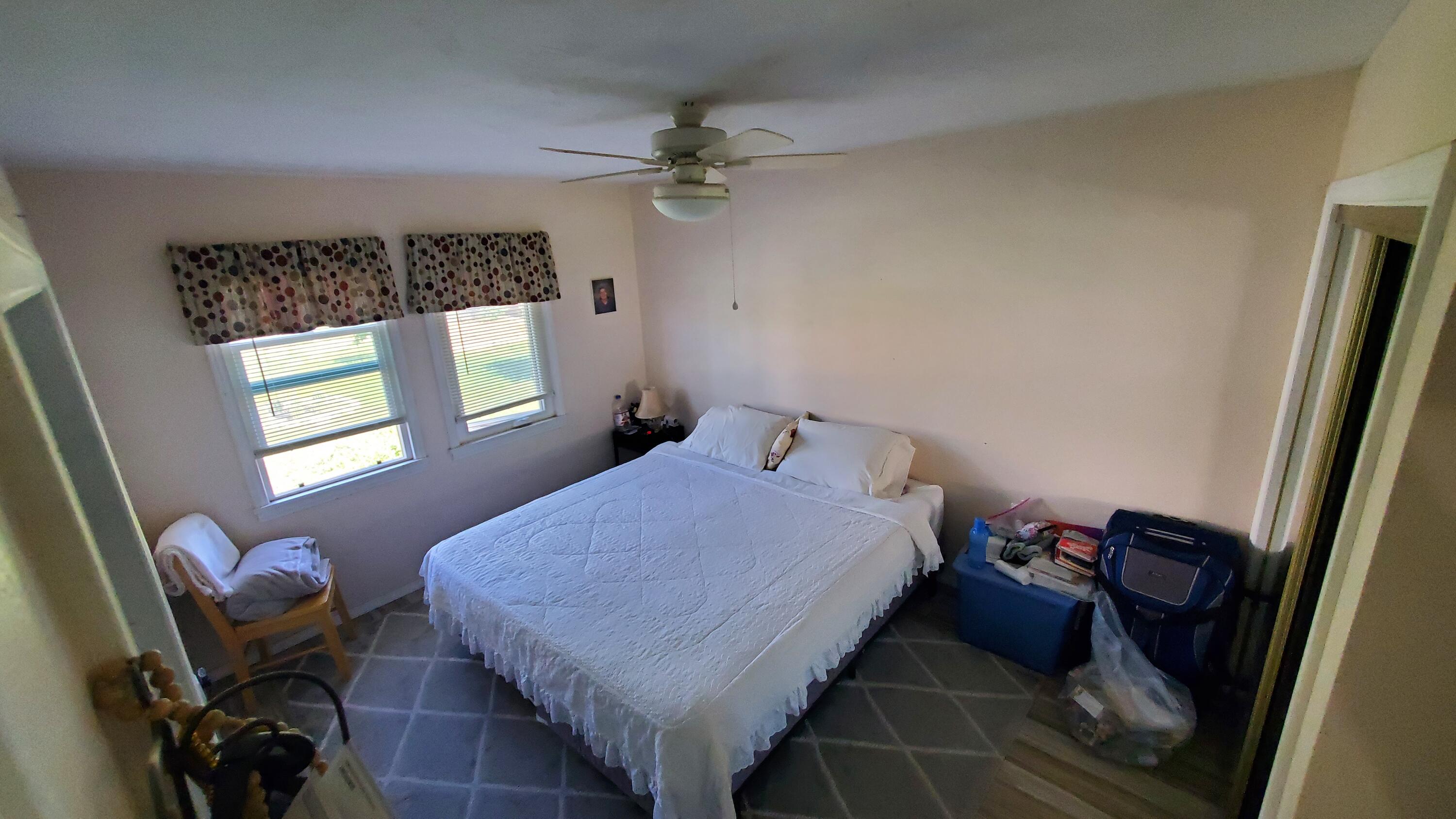 831 West George Street Banning, CA 92220 - Photo 17 of 39 a bedroom with a bed and a window