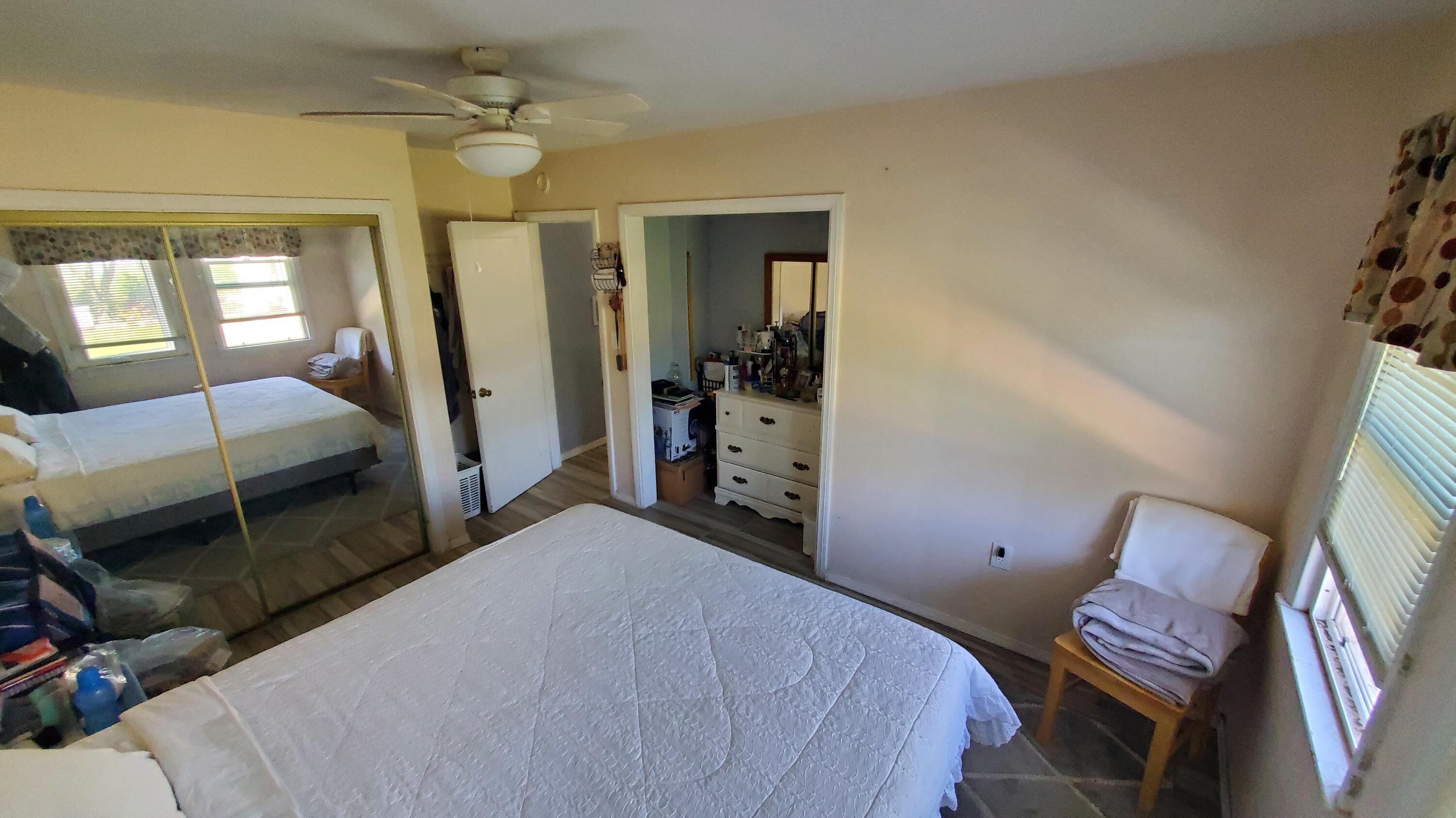 831 West George Street Banning, CA 92220 - Photo 18 of 39 a bedroom with a bed and a mirror