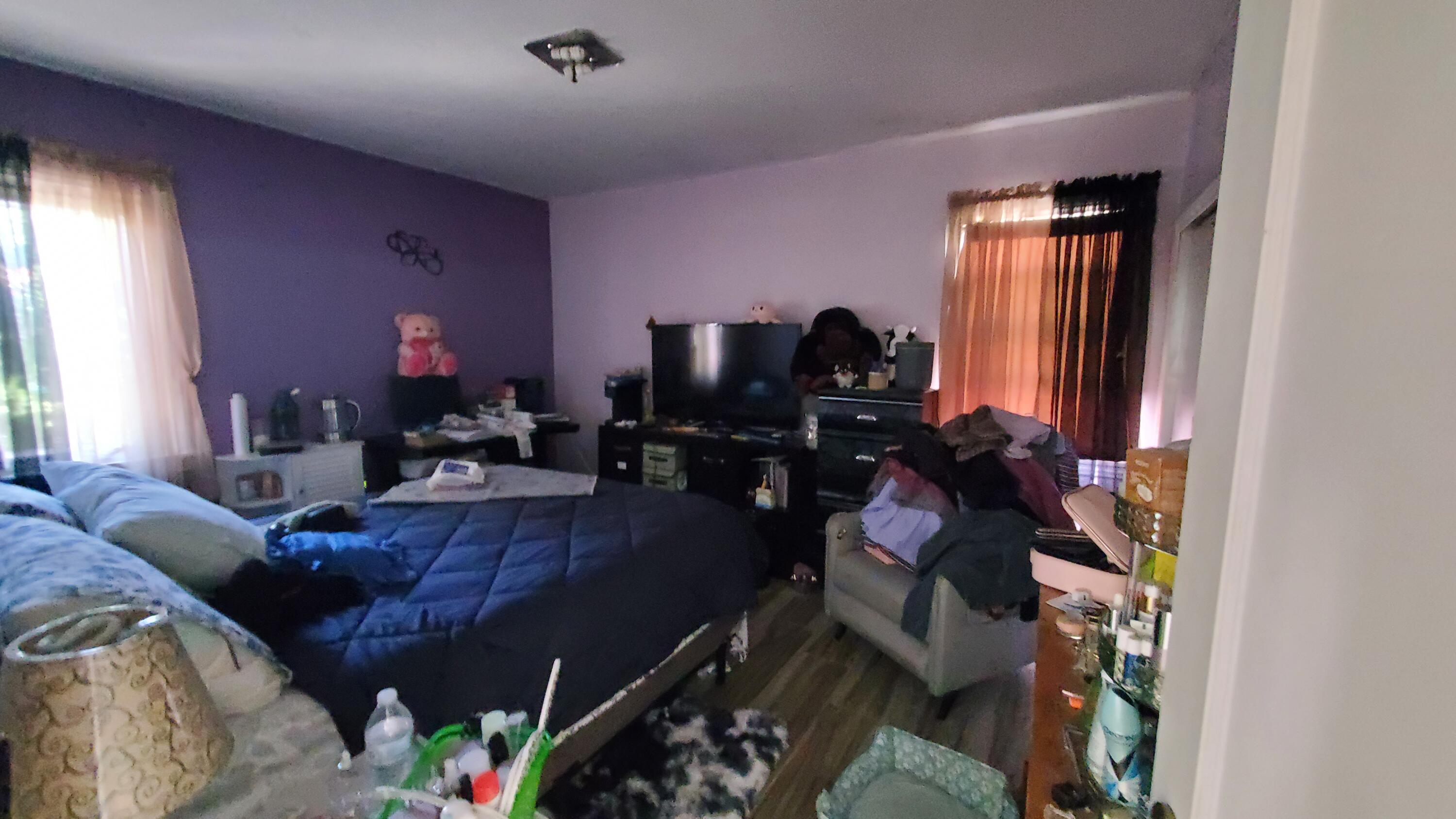 831 West George Street Banning, CA 92220 - Photo 19 of 39 a living room with furniture and a window