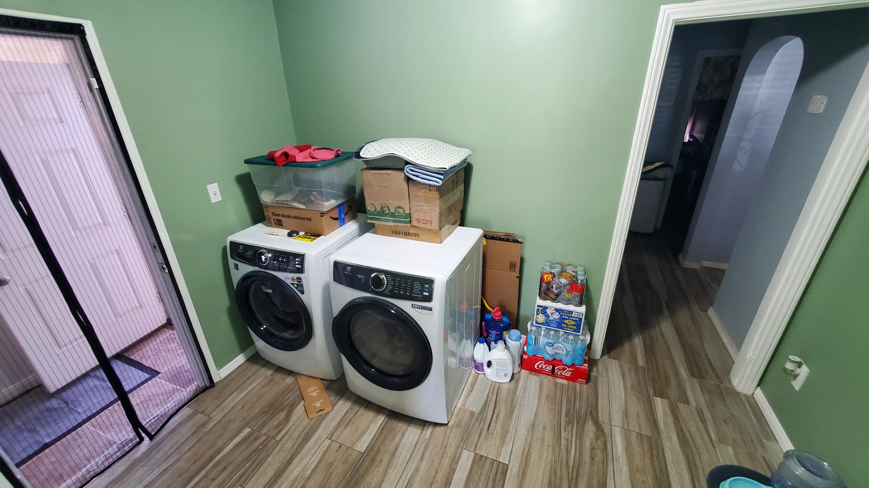 831 West George Street Banning, CA 92220 - Photo 10 of 39 a view of storage and utility room with washer and dryer