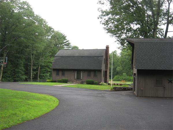 333 New Boston Road Sturbridge, MA 01566 - Photo 1 of 24 a front view of a house with a yard
