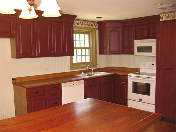 333 New Boston Road Sturbridge, MA 01566 - Photo 6 of 24 a kitchen with stainless steel appliances granite countertop a sink dishwasher a stove and a microwave oven with cabinets