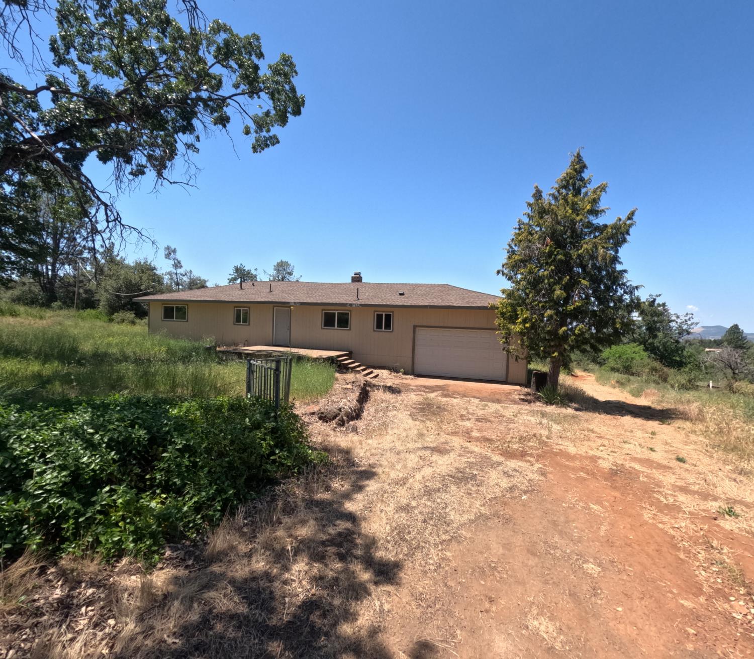 a pathway of a house with a yard