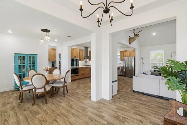 a living room with fireplace furniture and a flat screen tv