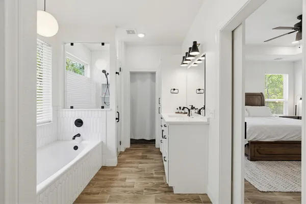 a bathroom with a bathtub and a shower