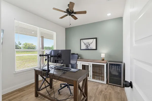a workspace with furniture and a window