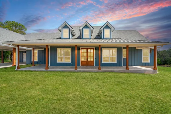 front view of a house with a yard