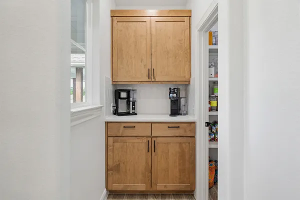 a view of cabinets and window