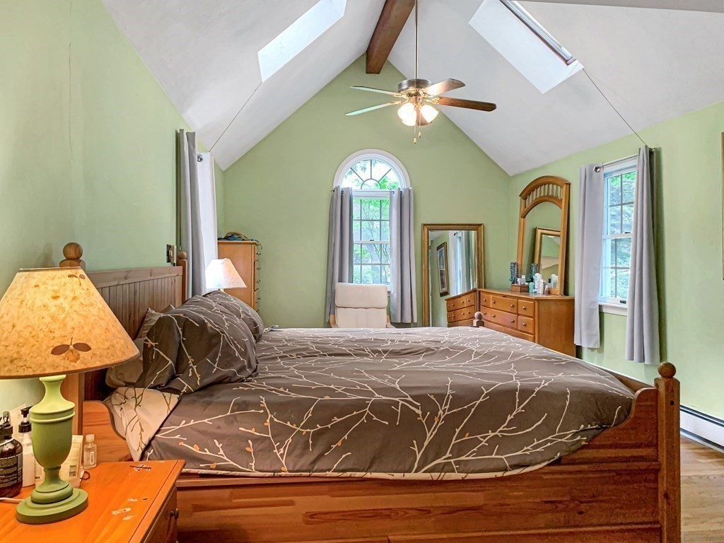 139 Simonds Road Lexington, MA 02420 - Photo 13 of 28 a bedroom with a bed and ceiling mirror