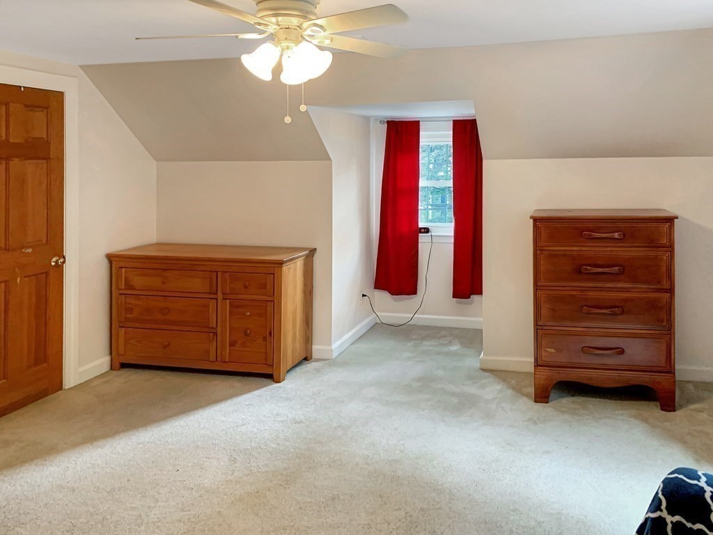 139 Simonds Road Lexington, MA 02420 - Photo 17 of 28 a view of a bedroom with closet and cabinet