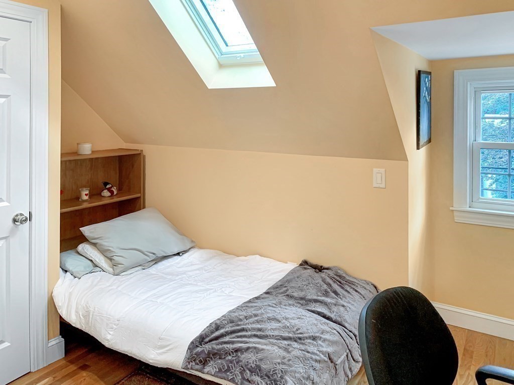 139 Simonds Road Lexington, MA 02420 - Photo 18 of 28 a bedroom with a bed and a window