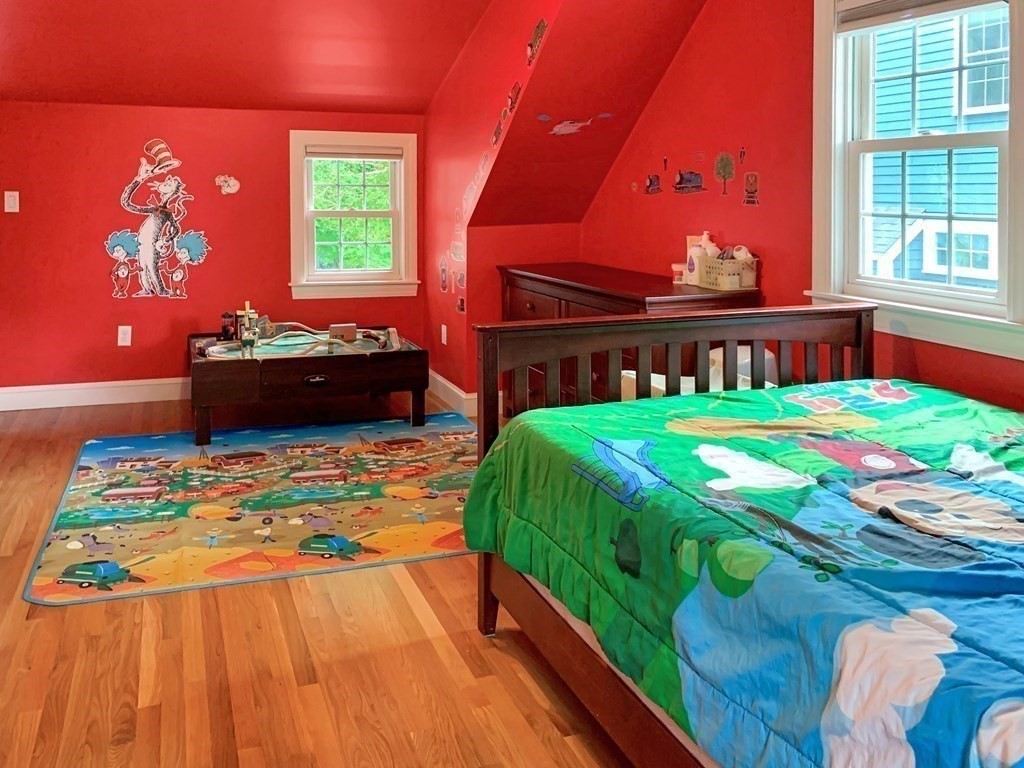 139 Simonds Road Lexington, MA 02420 - Photo 19 of 28 a bedroom with a bed and a dresser
