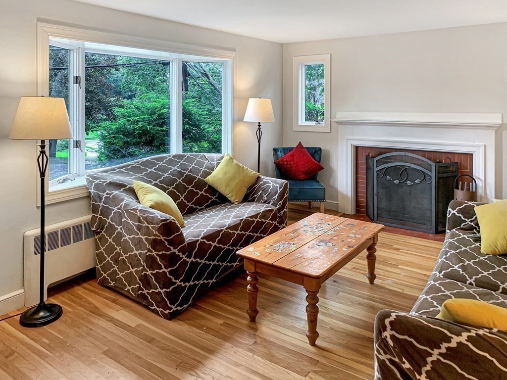 139 Simonds Road Lexington, MA 02420 - Photo 2 of 28 a living room with furniture and a fireplace