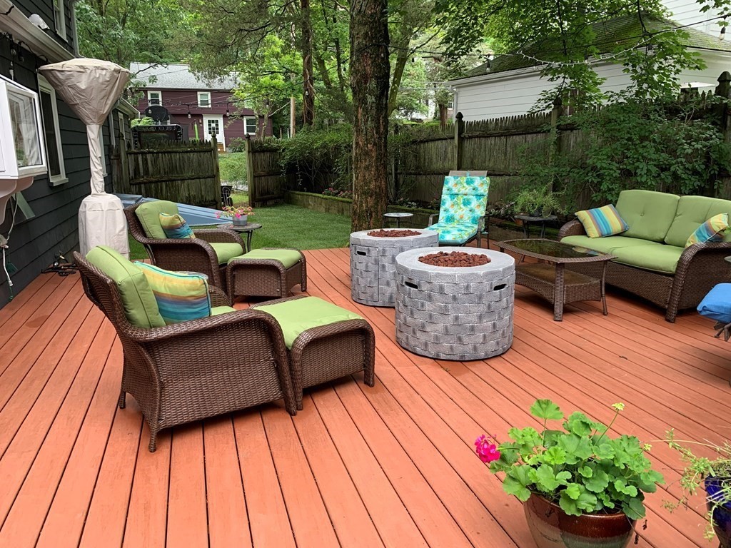 139 Simonds Road Lexington, MA 02420 - Photo 22 of 28 a view of a patio with couches table and chairs and potted plants