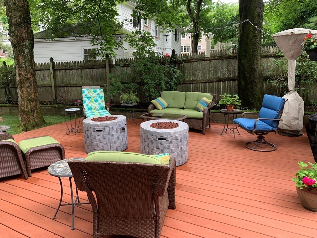 139 Simonds Road Lexington, MA 02420 - Photo 23 of 28 a view of a patio with couches chairs and a potted plant