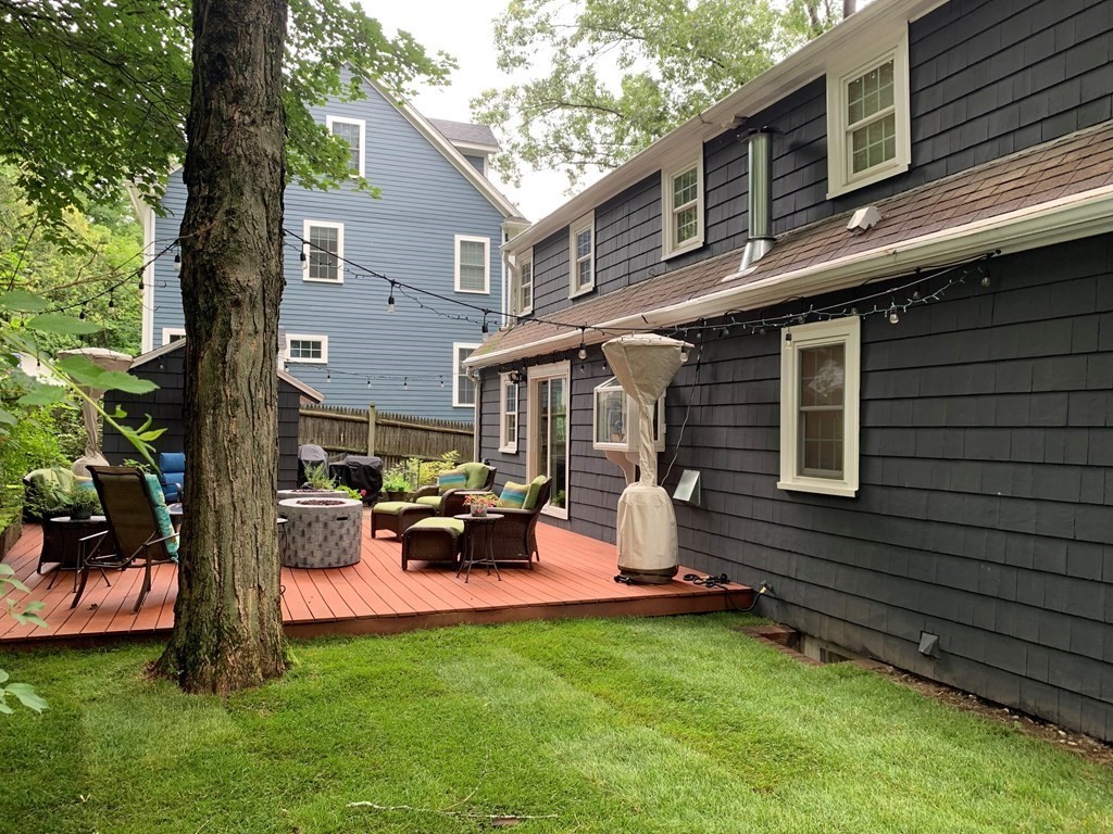 139 Simonds Road Lexington, MA 02420 - Photo 24 of 28 a backyard of a house with table and chairs