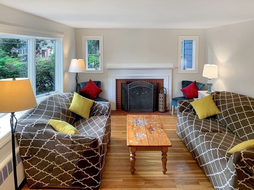 139 Simonds Road Lexington, MA 02420 - Photo 3 of 28 a living room with furniture and a fireplace