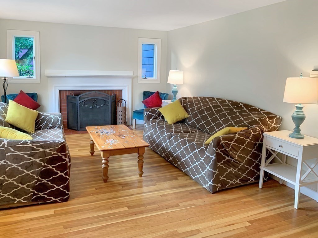 139 Simonds Road Lexington, MA 02420 - Photo 4 of 28 a living room with furniture and a fireplace