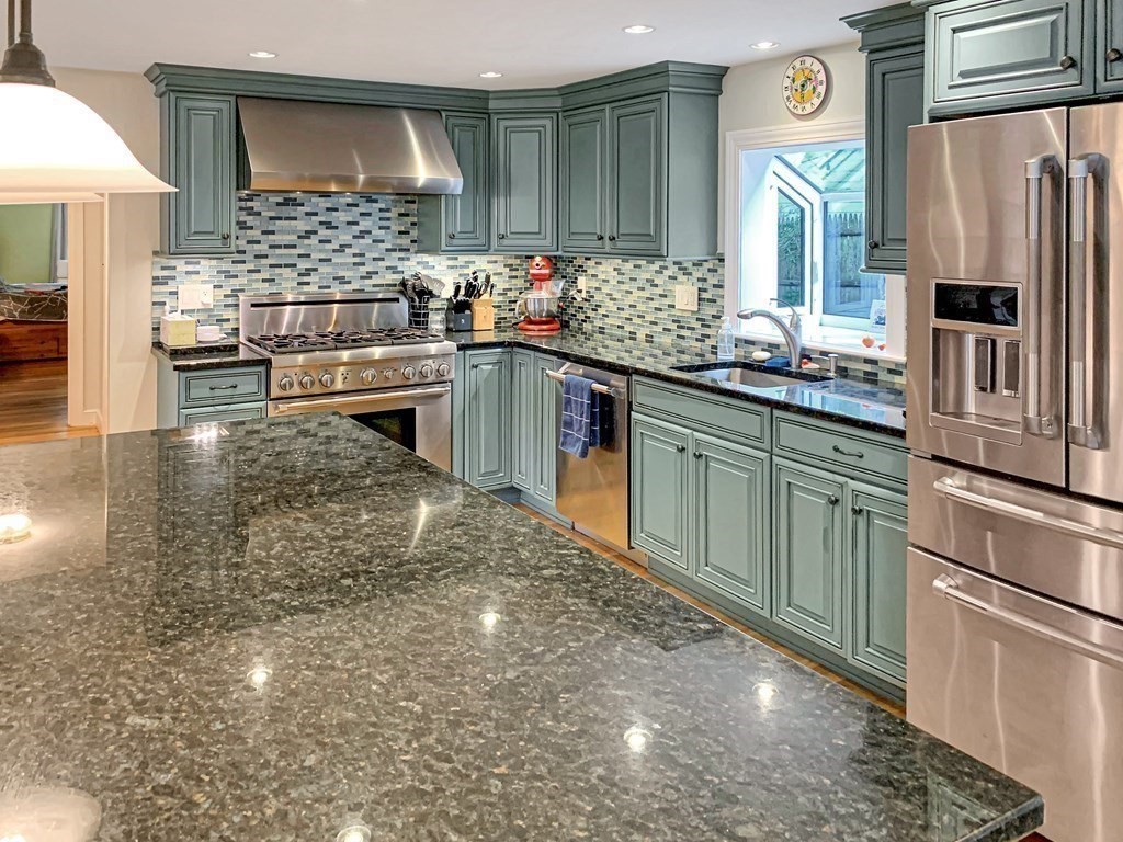 139 Simonds Road Lexington, MA 02420 - Photo 9 of 28 a kitchen with stainless steel appliances a sink stove and refrigerator