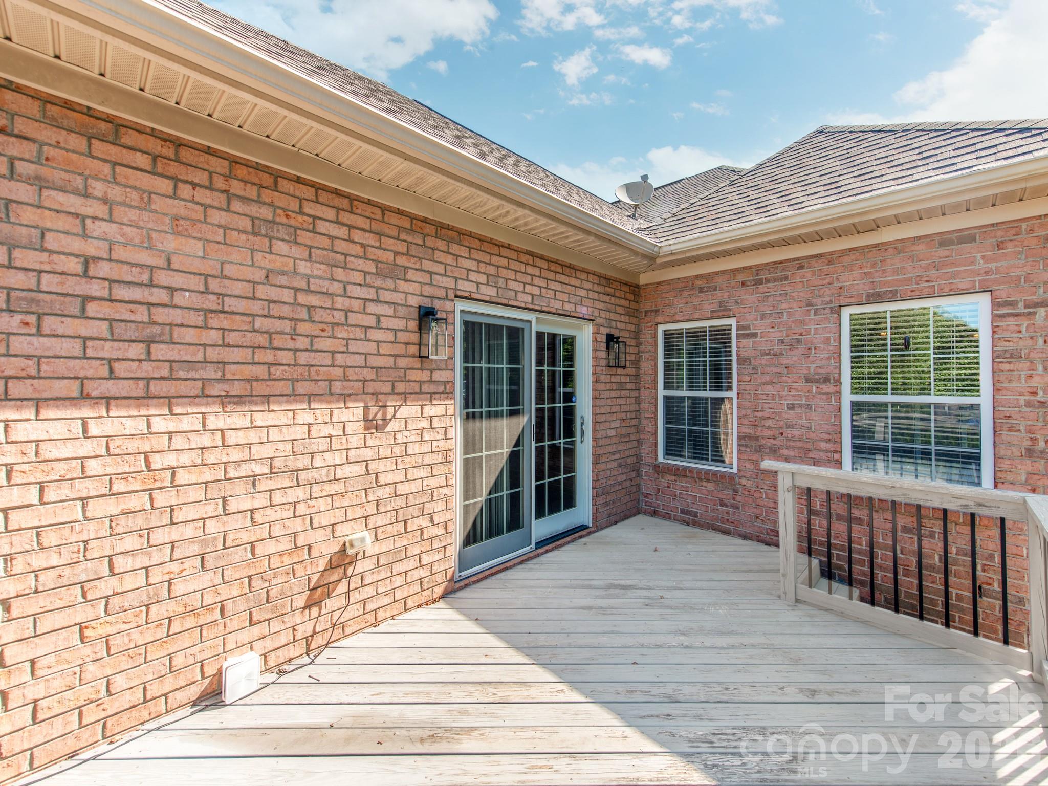 783 Sloan Street Denver, NC 28037 - Photo 30 of 44 a view of a brick house with large windows