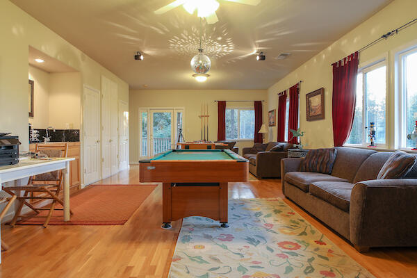 1050 Spring Road Shelter Cove, CA 95589 - Photo 24 of 42 a living room with furniture a large window and kitchen view