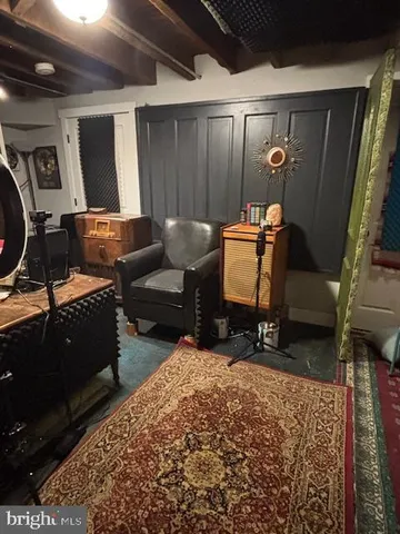 a bedroom with a bed window and a table