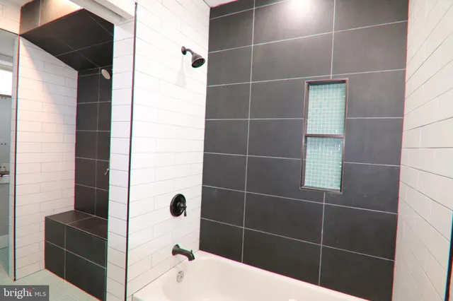 a view of a room with lots of furniture and wooden floor