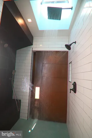 a view of an entryway with wooden floor