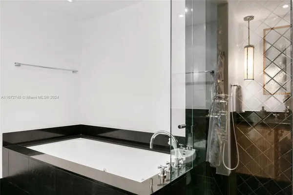 a bathroom with a toilet a sink and a mirror