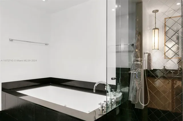 a bathroom with a toilet a sink and a mirror