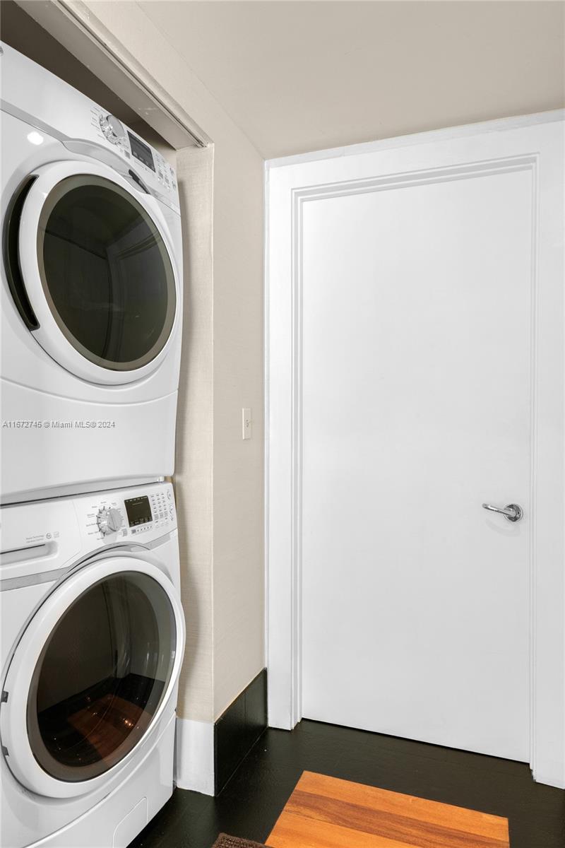 101 20th Street, Unit 2706 Miami Beach, FL 33139 - Photo 19 of 22 a view of a hallway with washer and dryer