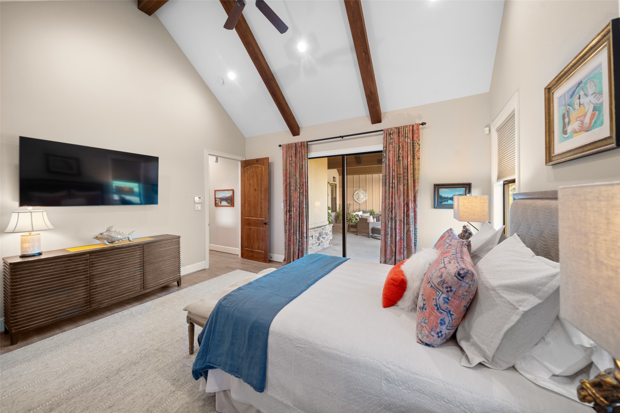 30163 High Spirit Ranch Road Hempstead, TX 77445 - Photo 21 of 49 a bedroom with a bed and a flat tv screen on dresser