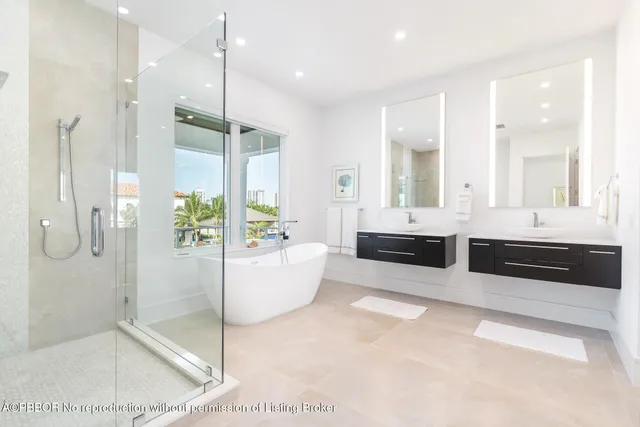 a large bathroom with a large tub and shower