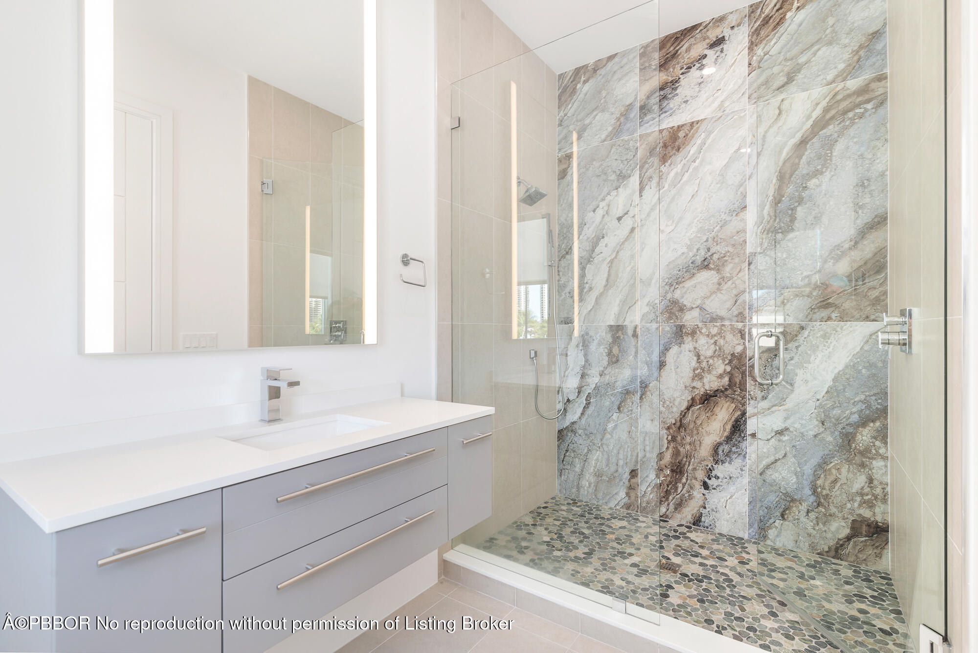 1180 Bimini Lane Riviera Beach, FL 33404 - Photo 22 of 35 a bathroom with a sink and a mirror