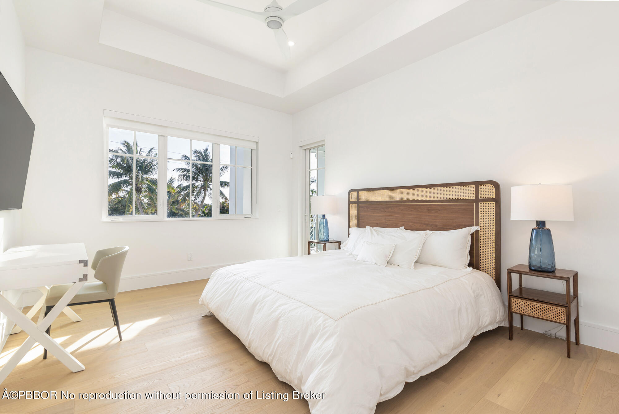 1180 Bimini Lane Riviera Beach, FL 33404 - Photo 23 of 35 a bedroom with a bed a table and chair