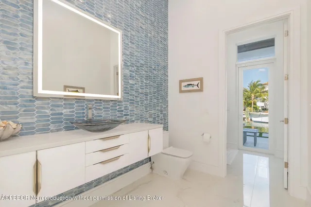 a bathroom with a toilet a sink and a bathtub