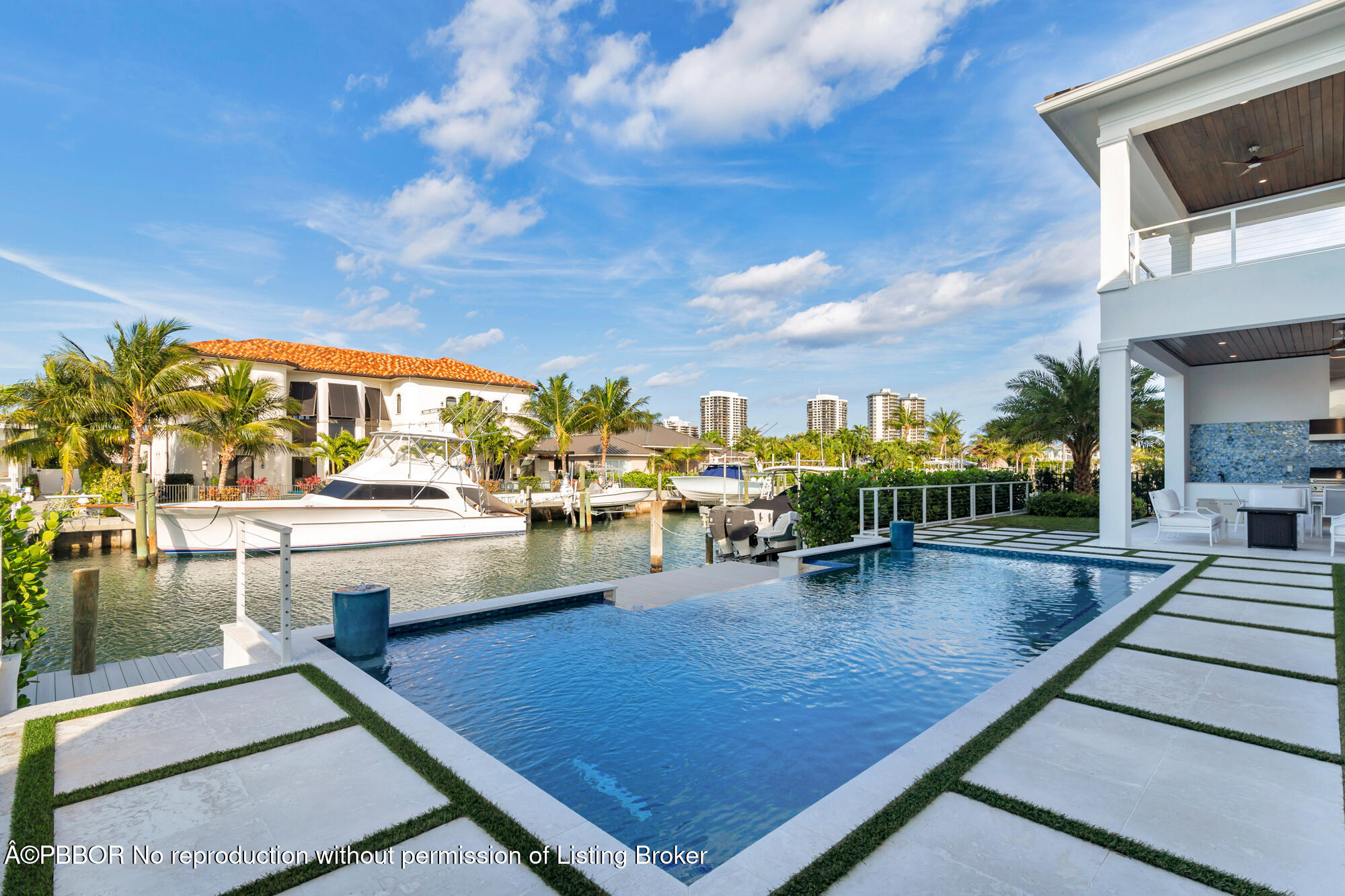 1180 Bimini Lane Riviera Beach, FL 33404 - Photo 27 of 35 a view of a swimming pool with outdoor seating