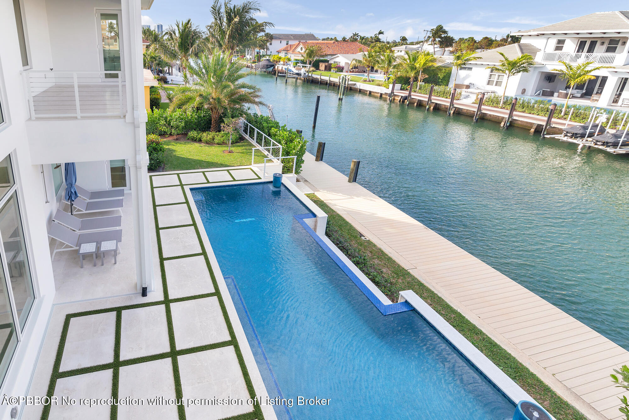 1180 Bimini Lane Riviera Beach, FL 33404 - Photo 28 of 35 a view of a balcony with chairs and a table