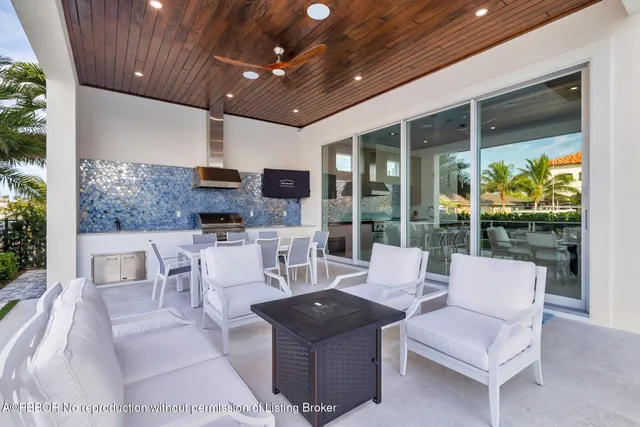 a view of a patio with a dining table and chairs
