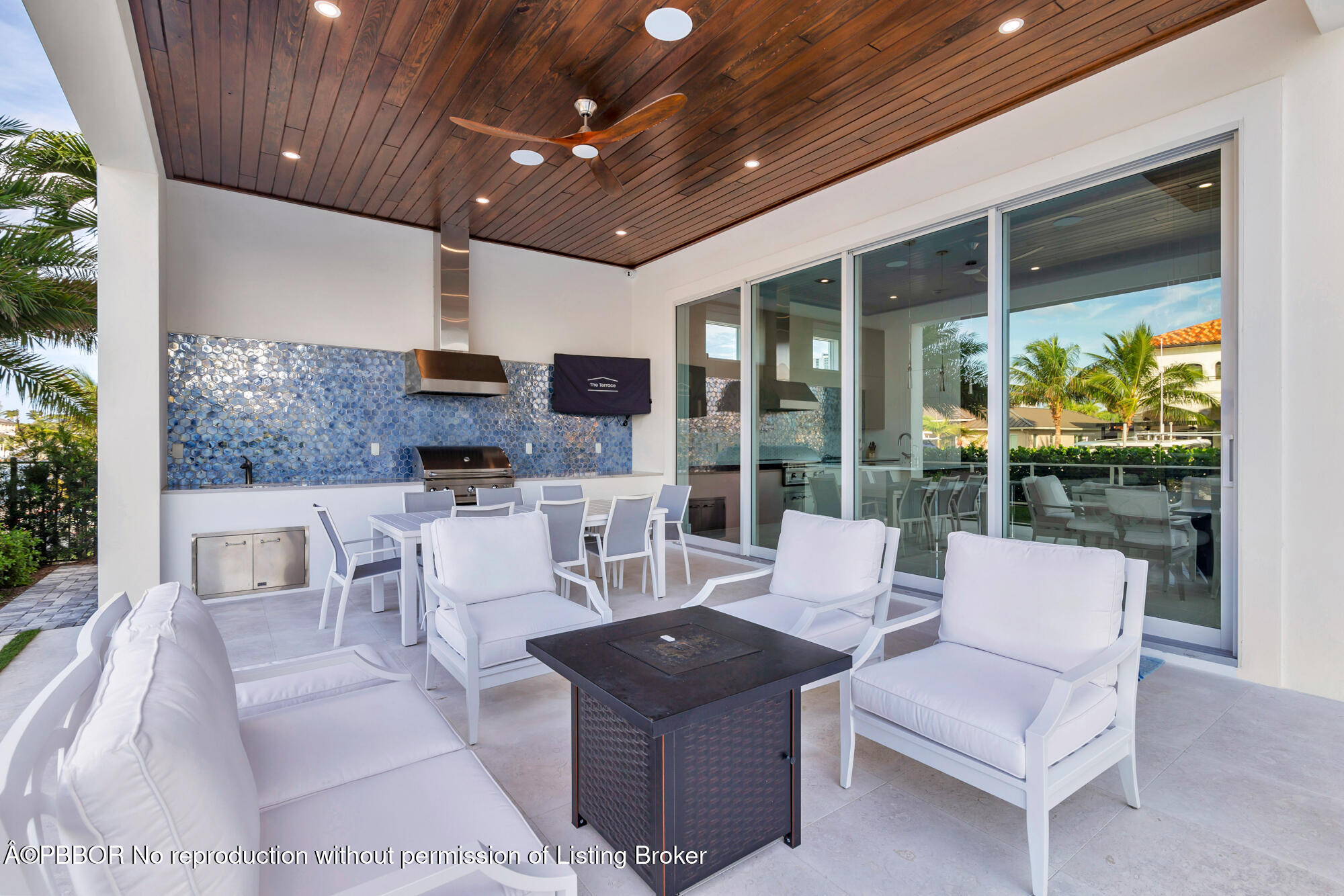 1180 Bimini Lane Riviera Beach, FL 33404 - Photo 29 of 35 a living room with furniture a ceiling fan and a large window