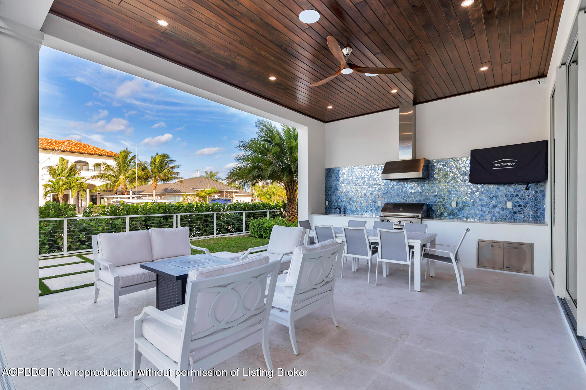 1180 Bimini Lane Riviera Beach, FL 33404 - Photo 30 of 35 a view of a patio with a dining table and chairs