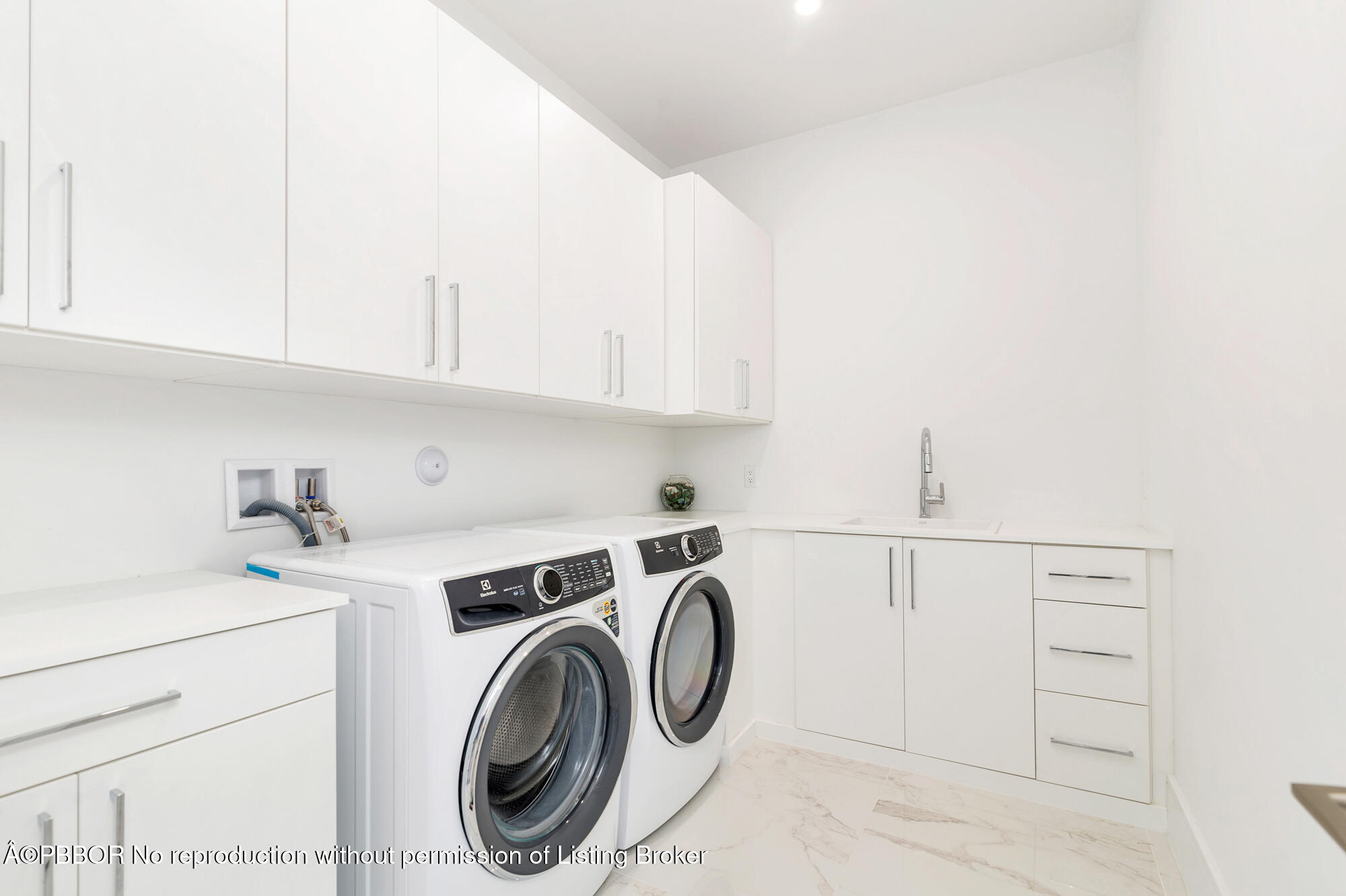 1180 Bimini Lane Riviera Beach, FL 33404 - Photo 31 of 35 a utility room with dryer and washer