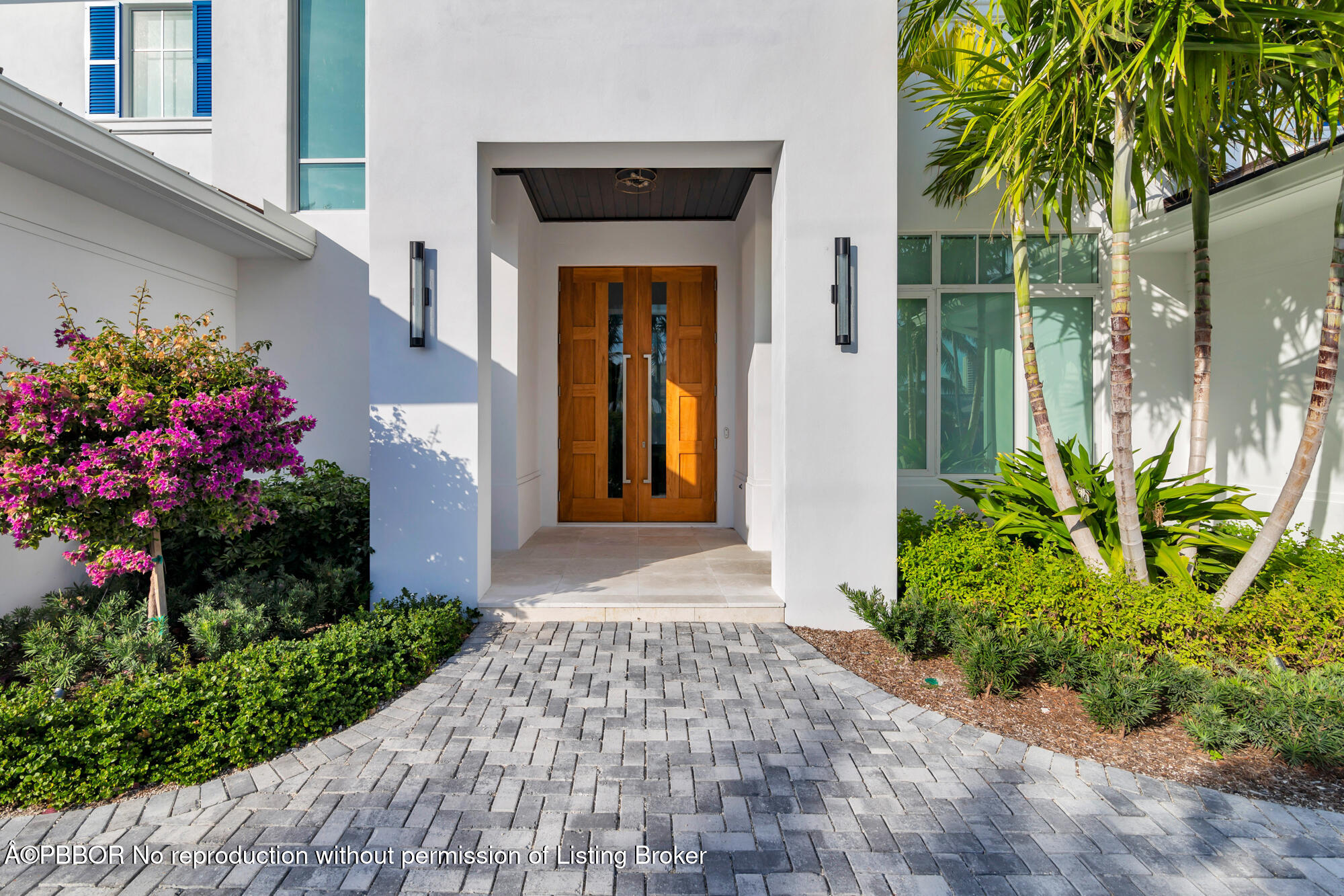 1180 Bimini Lane Riviera Beach, FL 33404 - Photo 4 of 35 a front view of a house with a porch