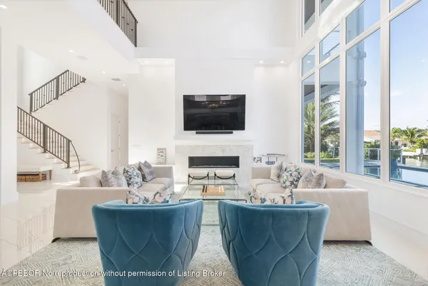 a living room with fireplace furniture and a flat screen tv