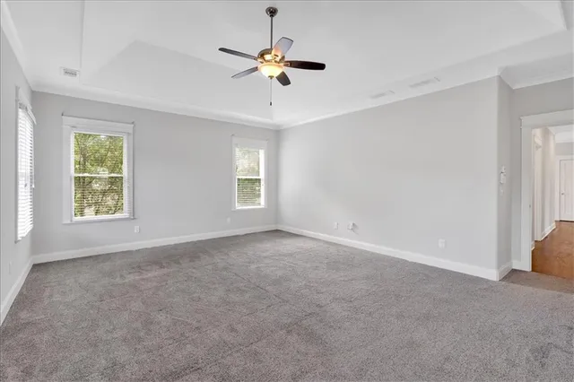 a bathroom with a toilet and a window