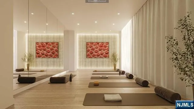 a lobby with furniture and a rug