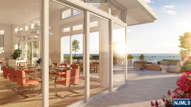 a balcony view with couches and potted plants