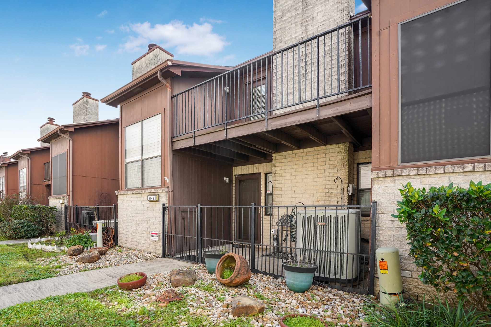 50 Evanston Street, Unit 3 Houston, TX 77015 - Photo 20 of 21 a backyard of a house with glass top table and chairs